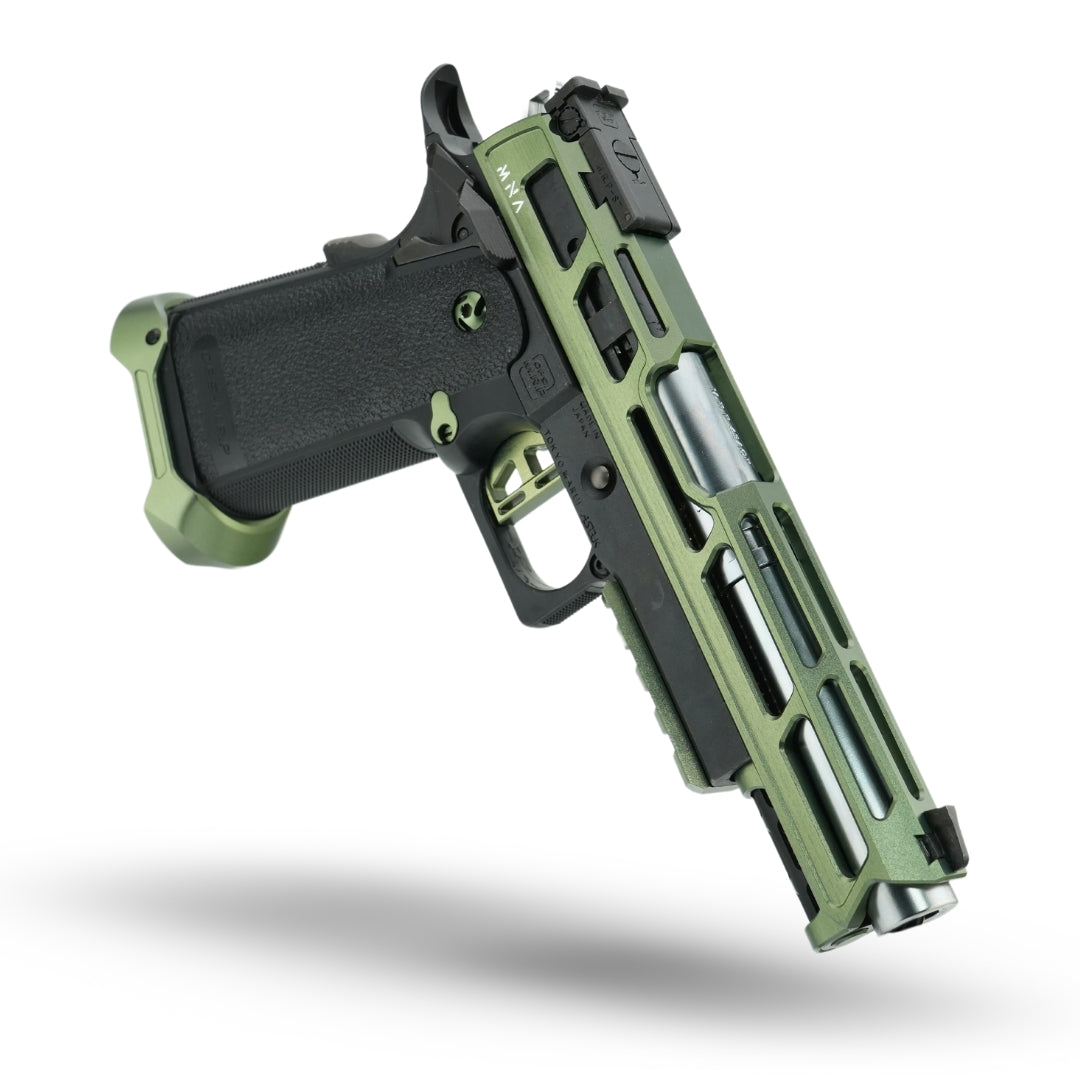 MNA project artemis is a black and army green tokyo marui hi capa. This gas blowback airsoft pistol is a tokyo marui hi capa 5.1 that has been upgraded with custom upgrades for the hi capa airsoft pistol platform. Ejection port barrel side