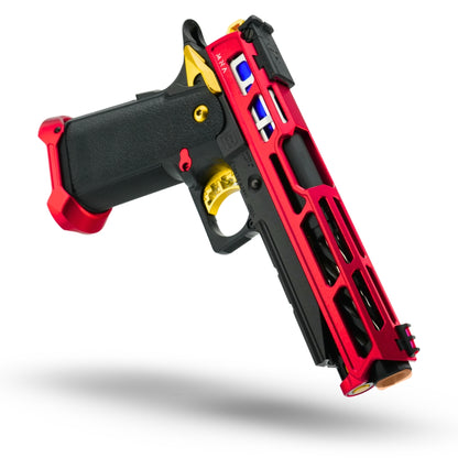 Close-up of upgraded TM Hi-Capa 5.1 Gold Match with MNA skeletonized magazine release (red), MNA fluted guide rod (gold), Lambda 6.01mm stainless steel inner barrel (113mm), and Maple Leaf 70-degree 2023 Autobot bucking for enhanced accuracy.