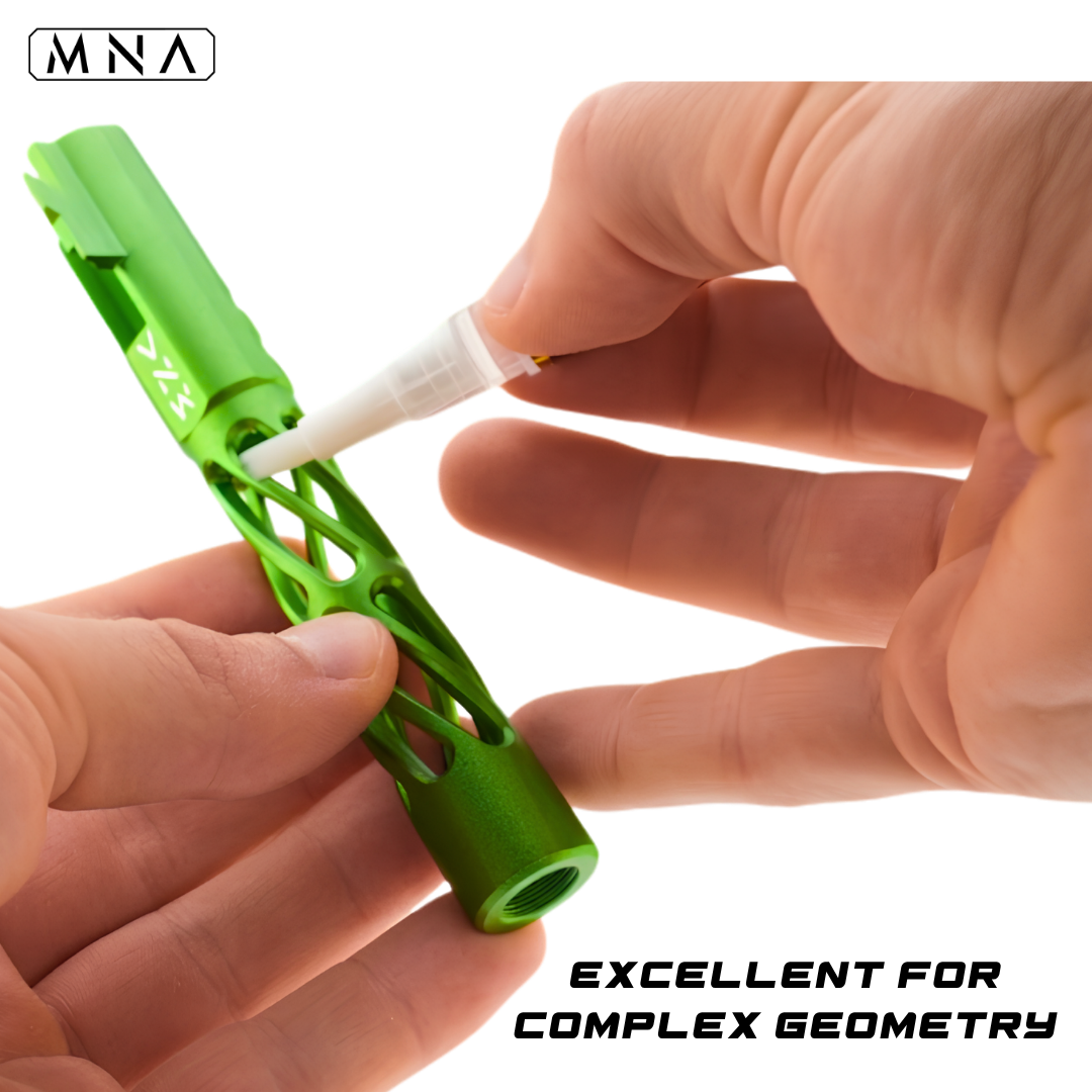Silicone oil brush with MNA branding on a white background. Silicone oil brush pen for airsoft guns with PTFE. Neon green CNC hi capa metal upgraded outer barrel for hi capa airsoft pistol.